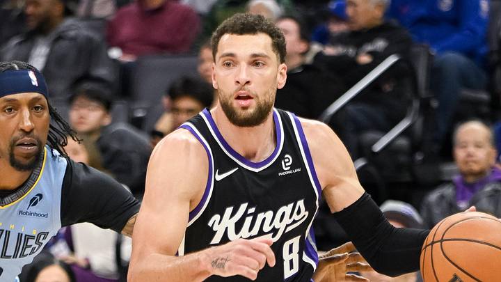 Feb 4, 2026; Sacramento, California, USA; Sacramento Kings guard Zach LaVine (8) dribbles past Memphis Grizzlies guard Kentavious Caldwell-Pope (3) during the third quarter at Golden 1 Center. Mandatory Credit: Ed Szczepanski-Imagn Images
