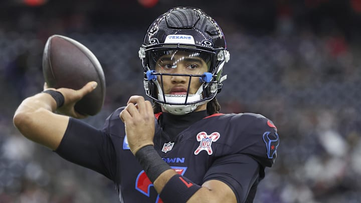 Dec 15, 2024; Houston, Texas, USA; Houston Texans quarterback C.J. Stroud (7) warms up before the game against the Baltimore Ravens at NRG Stadium. Mandatory Credit: Troy Taormina-Imagn Images