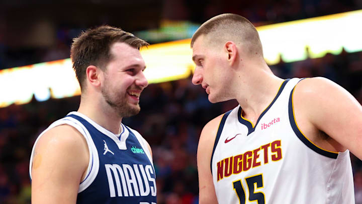 Mar 17, 2024; Dallas, Texas, USA;  Dallas Mavericks guard Luka Doncic (77) speaks with Denver Nuggets center Nikola Jokic (15) during the second half at American Airlines Center. Mandatory Credit: Kevin Jairaj-Imagn Images