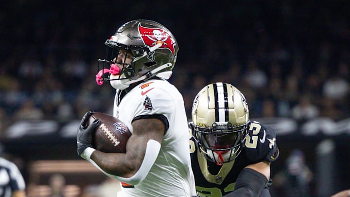 Oct 13, 2024; New Orleans, Louisiana, USA; Tampa Bay Buccaneers running back Bucky Irving (7) runs against New Orleans Saints cornerback Marshon Lattimore (23) during he first half at Caesars Superdome. Mandatory Credit: Stephen Lew-Imagn Images Oct 13, 2024; New Orleans, Louisiana, USA; Tampa Bay Buccaneers running back Bucky Irving (7) runs against New Orleans Saints cornerback Marshon Lattimore (23) during he first half at Caesars Superdome. Mandatory Credit: Stephen Lew-Imagn Images