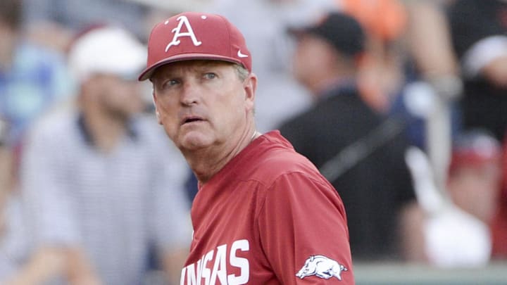 Arkansas Razorbacks coach Dave Van Horn walks off the field during the third inning against the Oregon State Beavers in game three of the championship series of the College World Series at TD Ameritrade Park. 
