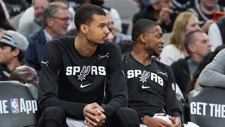 Mar 8, 2026; San Antonio, Texas, USA;  San Antonio Spurs forward Victor Wembanyama (1) and guard De'aaron Fox (4) on the bench in the second half against the Houston Rockets at Frost Bank Center. Mandatory Credit: Daniel Dunn-Imagn Images