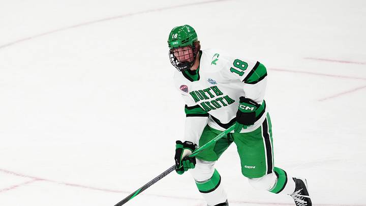 Apr 9, 2026; Las Vegas, Nevada, UNITED STATES; North Dakota Fighting Hawks defenseman Keaton Verhoeff (18) moves the puck in the first period against the Wisconsin Badgers in the semifinals of the NCAA men's ice hockey Frozen Four at T-Mobile Arena. Apr 9, 2026; Las Vegas, Nevada, UNITED STATES; North Dakota Fighting Hawks defenseman Keaton Verhoeff (18) moves the puck in the first period against the Wisconsin Badgers in the semifinals of the NCAA men's ice hockey Frozen Four at T-Mobile Arena.