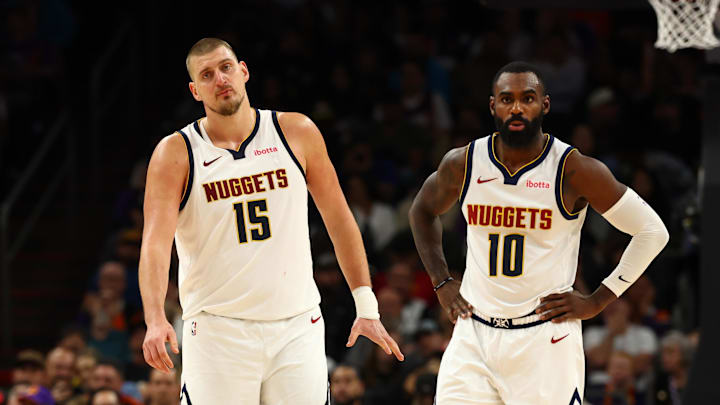 Nov 29, 2025; Phoenix, Arizona, USA; Denver Nuggets center Nikola Jokic (15) and guard Tim Hardaway Jr. (10) against the Phoenix Suns at the Mortgage Matchup Center.