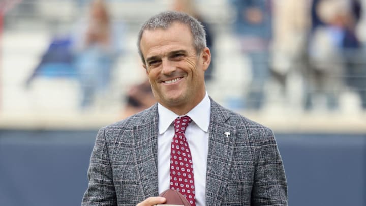  South Carolina Gamecocks head coach Shane Beamer holds a football and reacts on the field before the game against the Mississippi Rebels at Vaught-Hemingway Stadium.