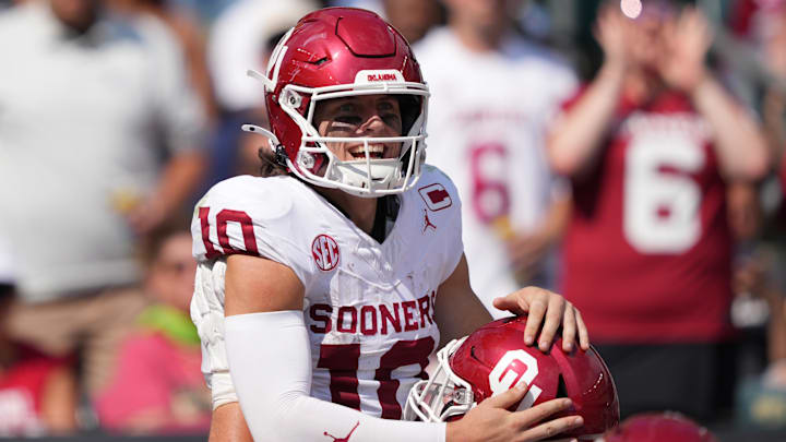 Oklahoma quarterback John Mateer celebrates a touchdown run against Temple.