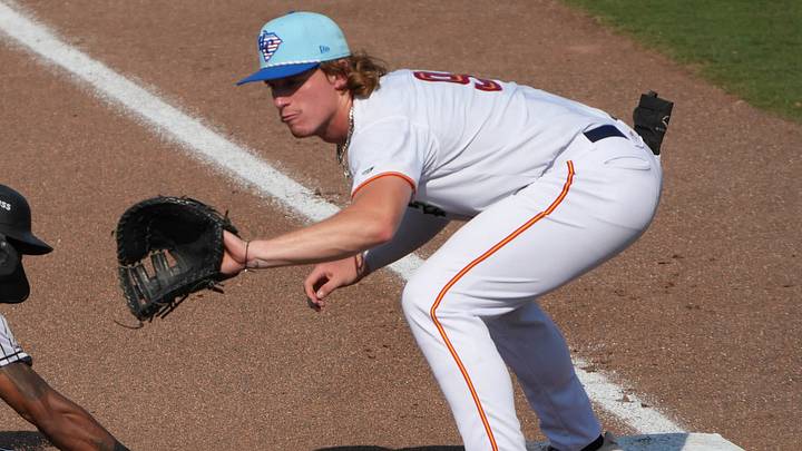 Spartanburger infielder Rafe Perich (9) tries to pick off Winston-Salem outfielder Terrell Tatum (13) during the top of the third inning at Fifth Third Bank Field in Spartanburg, S.C. July 4, 2025.