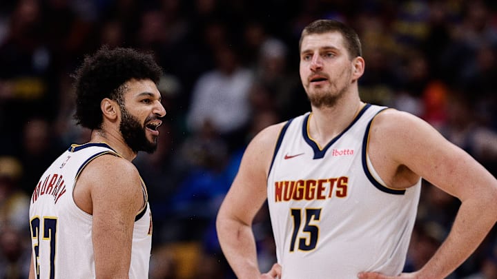 Feb 10, 2025; Denver, Colorado, USA; Denver Nuggets guard Jamal Murray (27) reacts after a call as center Nikola Jokic (15) looks on in the third quarter against the Portland Trail Blazers at Ball Arena. Mandatory Credit: Isaiah J. Downing-Imagn Images