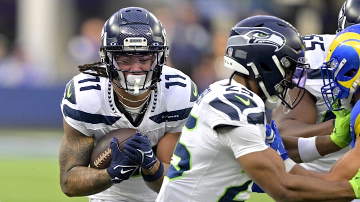 Jan 5, 2025; Inglewood, California, USA; Seattle Seahawks wide receiver Jaxon Smith-Njigba (11) runs the ball in the first half against the Los Angeles Rams at SoFi Stadium. Jan 5, 2025; Inglewood, California, USA; Seattle Seahawks wide receiver Jaxon Smith-Njigba (11) runs the ball in the first half against the Los Angeles Rams at SoFi Stadium.