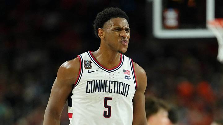 Apr 4, 2026; Indianapolis, IN, USA; UConn Huskies forward Tarris Reed Jr. (5) reacts after a play against the Illinois Fighting Illini during the first half of a semifinal of the Final Four of the men's 2026 NCAA Tournament at Lucas Oil Stadium. Mandatory Credit: Bob Donnan-Imagn Images Apr 4, 2026; Indianapolis, IN, USA; UConn Huskies forward Tarris Reed Jr. (5) reacts after a play against the Illinois Fighting Illini during the first half of a semifinal of the Final Four of the men's 2026 NCAA Tournament at Lucas Oil Stadium. Mandatory Credit: Bob Donnan-Imagn Images