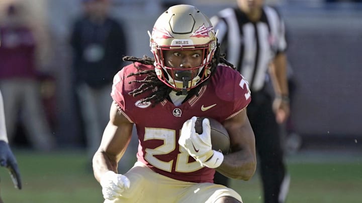 Nov 23, 2024; Tallahassee, Florida, USA; Florida State Seminoles running back Samuel Singleton Jr. (28) runs the ball against the Charleston Southern Buccaneers during the second half at Doak S. Campbell Stadium. Mandatory Credit: Melina Myers-Imagn Images