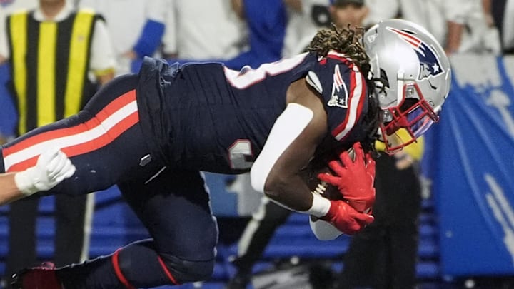 New England Patriots running back Rhamondre Stevenson (38) rushes for a touchdown against the Buffalo Bills during the second half at Highmark Stadium. Mandatory Credit: Gregory Fisher-Imagn Images
