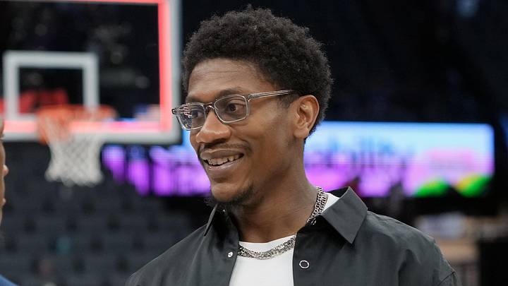 Apr 5, 2026; Sacramento, California, USA; Sacramento Kings forward De'Andre Hunter (right) talks to LA Clippers guard Kris Dunn (left) after the game at Golden 1 Center. Mandatory Credit: Darren Yamashita-Imagn Images