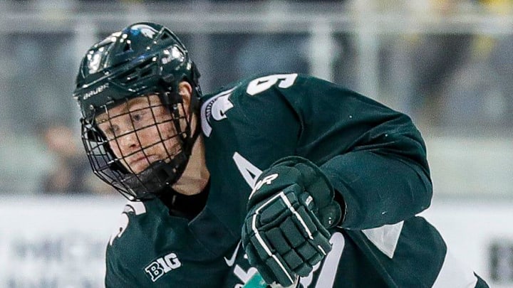 Michigan State defenseman Matt Basgall makes a pass against Michigan during the first period at Yost Ice Arena in Ann Arbor on Friday, Feb. 9, 2024.
