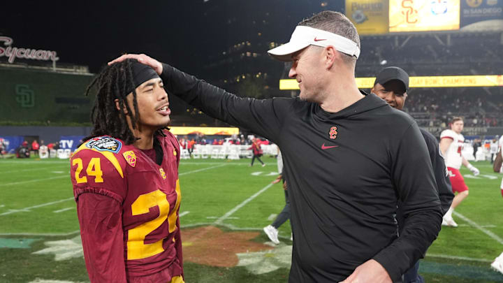 Dec 27, 2023; San Diego, CA, USA; Southern California Trojans head coach Lincoln Riley (right) celebrates with wide receiver Makai Lemon (24) after the Holiday Bowl against the Louisville Cardinals at Petco Park. Mandatory Credit: Kirby Lee-Imagn Images