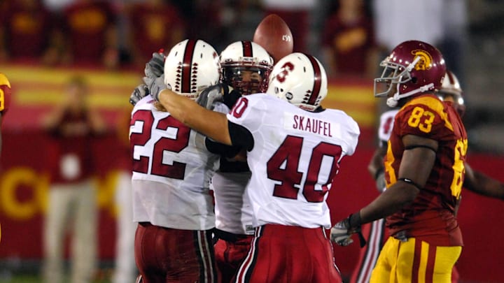 Stanford free safety Bo McNally (22) is embraced by Nick Sanchez (22) and Taylor Skaufel (40) after interception in the final minute of 24-23 victory over Southern California at the Los Angeles Memorial Coliseum. Stanford free safety Bo McNally (22) is embraced by Nick Sanchez (22) and Taylor Skaufel (40) after interception in the final minute of 24-23 victory over Southern California at the Los Angeles Memorial Coliseum.