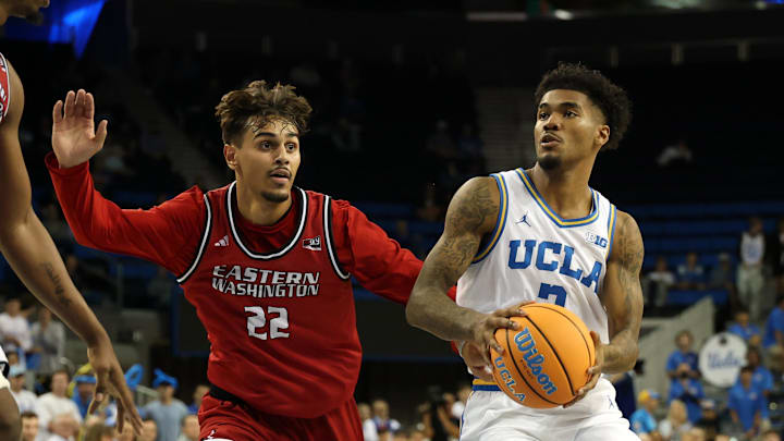 Nov 3, 2025; Los Angeles, California, USA;  UCLA Bruins guard Donovan Dent (2) drives to the basket against Eastern Washington Eagles guard Jojo Anderson (22) during the second half at Pauley Pavilion presented by Wescom Financial. Mandatory Credit: Kiyoshi Mio-Imagn Images