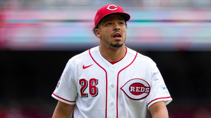 Cincinnati Reds pitcher Chase Burns (26) returns