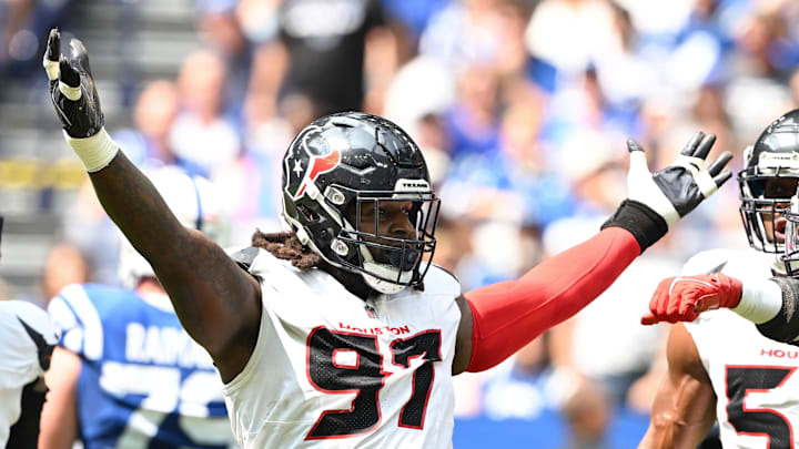 Sep 8, 2024; Indianapolis, Indiana, USA; Houston Texans defensive end Mario Edwards Jr. (97) celebrates a sack during the second quarter against the Indianapolis Colts at Lucas Oil Stadium. Mandatory Credit: Marc Lebryk-Imagn Images