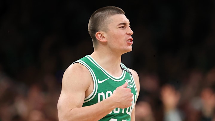 Jun 17, 2024; Boston, Massachusetts, USA; Boston Celtics guard Payton Pritchard (11) reacts after making a half-court shot at the buzzer to end the second quarter in game five of the 2024 NBA Finals at TD Garden. Mandatory Credit: Peter Casey-Imagn Images