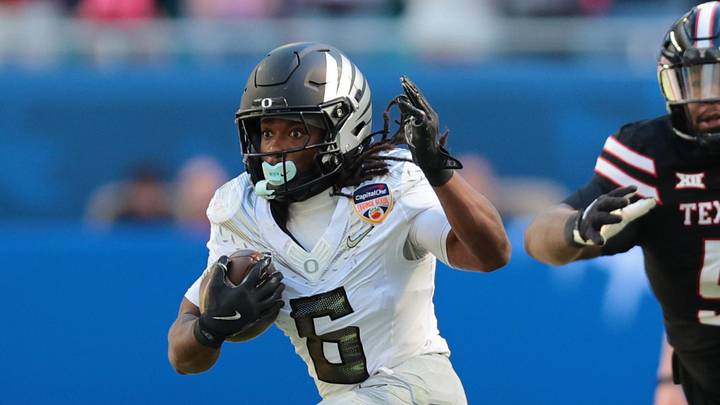 Jan 1, 2026; Miami Gardens, FL, USA; Oregon Ducks running back Noah Whittington (6) carries the ball against the Texas Tech Red Raiders during the first half of the 2025 Orange Bowl and quarterfinal game of the College Football Playoff at Hard Rock Stadium. Mandatory Credit: Sam Navarro-Imagn Images