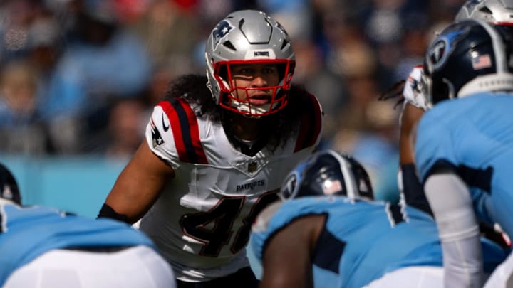 Oct 19, 2025; Nashville, Tennessee, USA;  New England Patriots linebacker Jahlani Tavai (48) sneaks a peak into the backfield against the Tennessee Titans during the second half at Nissan Stadium. Mandatory Credit: Steve Roberts-Imagn Images