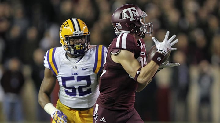 Texas A&M Aggies wide receiver Boone Niederhofer (82) makes a reception during the third quarter as LSU Tigers linebacker Kendell Beckwith (52) defends at Kyle Field.