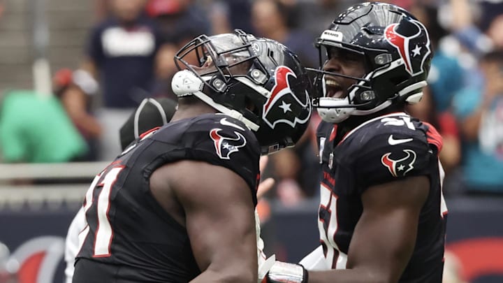 Sep 29, 2024; Houston, Texas, USA;  Houston Texans defensive tackle Folorunso Fatukasi (91) and teammates react after stopping Jacksonville Jaguars quarterback Trevor Lawrence (16) on fourth down in the second half at NRG Stadium. Mandatory Credit: Thomas Shea-Imagn Images