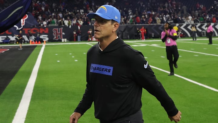 Jan 11, 2025; Houston, Texas, USA; Los Angeles Chargers head coach Jim Harbaugh walks off after losing to Houston Texans in an AFC wild card game at NRG Stadium. Mandatory Credit: Thomas Shea-Imagn Images