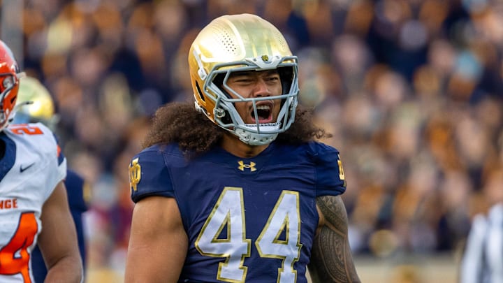 Nov 22, 2025; South Bend, Indiana, USA; Notre Dame Fighting Irish defensive lineman Junior Tuihalamaka (44) celebrates a stop against the Syracuse Orange during the first half at Notre Dame Stadium. 