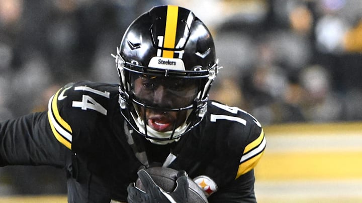 Jan 4, 2026; Pittsburgh, Pennsylvania, USA; Pittsburgh Steelers running back Kenneth Gainwell (14) runs  against the Baltimore Ravens during the first half at Acrisure Stadium. Mandatory Credit: Barry Reeger-Imagn Images