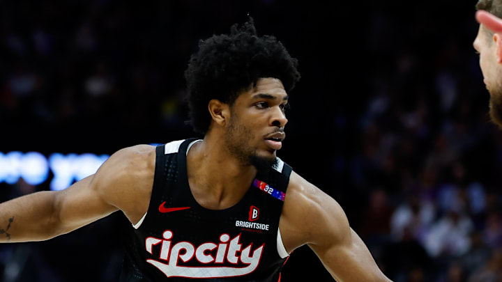 Mar 27, 2025; Sacramento, California, USA; Portland Trail Blazers guard Scoot Henderson (00) dribbles against Sacramento Kings forward Domantas Sabonis (11) during the third quarter at Golden 1 Center. Mandatory Credit: Sergio Estrada-Imagn Images Mar 27, 2025; Sacramento, California, USA; Portland Trail Blazers guard Scoot Henderson (00) dribbles against Sacramento Kings forward Domantas Sabonis (11) during the third quarter at Golden 1 Center. Mandatory Credit: Sergio Estrada-Imagn Images