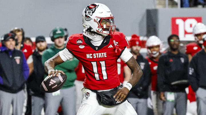 Nov 29, 2025; Raleigh, North Carolina, USA; NC State Wolfpack quarterback CJ Bailey (11) prepares to throw the football during the first half of the game against North Carolina Tar Heels at Carter-Finley Stadium. Mandatory Credit: Jaylynn Nash-Imagn Images Nov 29, 2025; Raleigh, North Carolina, USA; NC State Wolfpack quarterback CJ Bailey (11) prepares to throw the football during the first half of the game against North Carolina Tar Heels at Carter-Finley Stadium. Mandatory Credit: Jaylynn Nash-Imagn Images