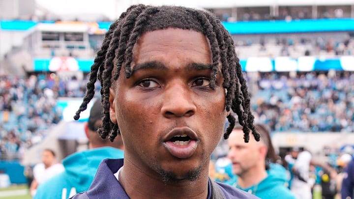 Tennessee Titans quarterback Cam Ward walks off the field after the game at EverBank Stadium.