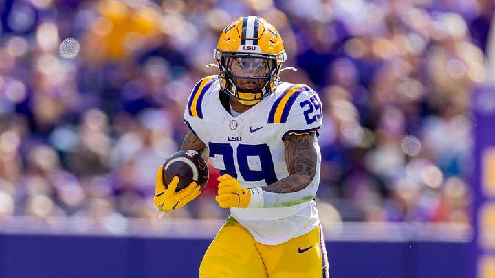 LSU Tigers running back Caden Durham (29) runs against the Arkansas Razorbacks during the first half at Tiger Stadium. LSU Tigers running back Caden Durham (29) runs against the Arkansas Razorbacks during the first half at Tiger Stadium.