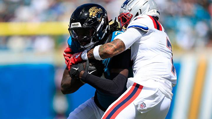 Jacksonville Jaguars wide receiver Brian Thomas Jr. (7) is tackled by New England Patriots cornerback Carlton Davis III (7) during the second quarter of an NFL football matchup at EverBank Stadium on Sunday, Sept. 27, 2026, in Jacksonville, Fla. The Jaguars defeated the Patriots 35-6. [Corey Perrine/Florida Times‑Union]