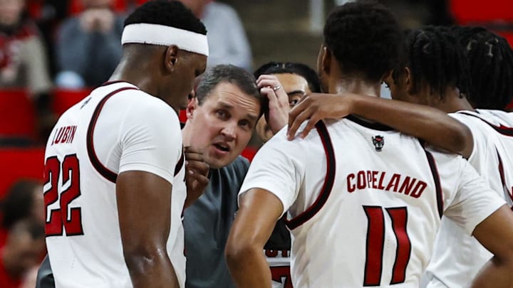 Dec 6, 2025; Raleigh, North Carolina, USA; NC State Wolfpack huddle with head coach Will Wade during the second half of the game against UNC Asheville Bulldogs at Lenovo Center. Mandatory Credit: Jaylynn Nash-Imagn Images