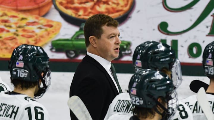 MSU hockey coach Adam Nightingale and his Spartans gather on the ice following MSU's 4-3 win over Notre Dame, Saturday, Nov. 15, 2024.