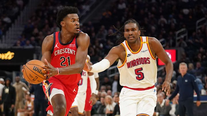 Oct 29, 2024; San Francisco, California, USA; New Orleans Pelicans center Yves Missi (21) drives past Golden State Warriors forward Kevon Looney (5) in the fourth quarter at the Chase Center. Mandatory Credit: Cary Edmondson-Imagn Images
