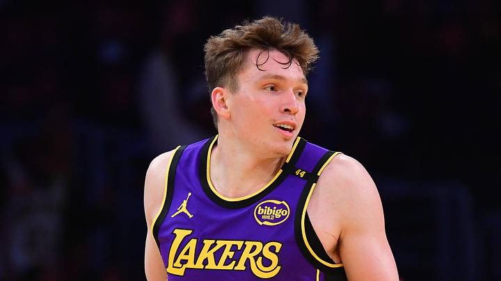 Nov 19, 2024; Los Angeles, California, USA; Los Angeles Lakers guard Dalton Knecht (4) react after scoring a three point basket against the Utah Jazz during the second half at Crypto.com Arena. Mandatory Credit: Gary A. Vasquez-Imagn Images