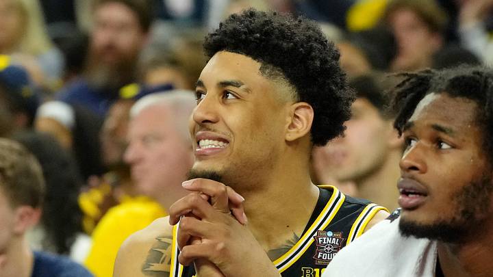 Apr 4, 2026; Indianapolis, IN, USA; Michigan Wolverines forward Yaxel Lendeborg (23) reacts on the bench during the second half in a semifinal of the Final Four of the men's 2026 NCAA Tournament at Lucas Oil Stadium. Mandatory Credit: Bob Donnan-Imagn Images