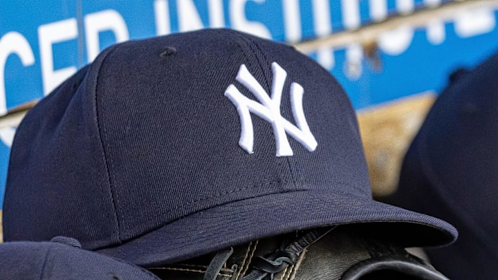 Apr 7, 2025; Detroit, Michigan, USA; New York Yankees baseball hats and gloves in the dugout out in the eighth inning against the Detroit Tigers at Comerica Park. 