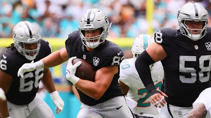 Nov 17, 2024; Miami Gardens, Florida, USA; Las Vegas Raiders tight end Michael Mayer (87) runs with the football against the Miami Dolphins during the first quarter at Hard Rock Stadium. Mandatory Credit: Sam Navarro-Imagn Images