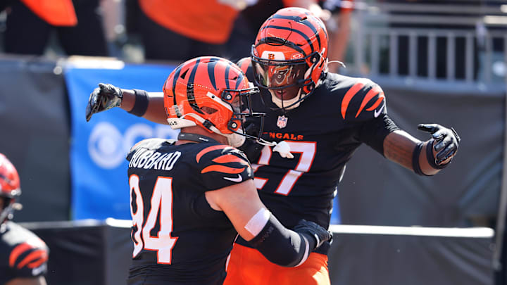 Oct 6, 2024; Cincinnati, Ohio, USA; Cincinnati Bengals defensive end Sam Hubbard (94) celebrates a safety with safety Jordan Battle (27) during the first half against the Baltimore Ravens at Paycor Stadium. Mandatory Credit: Joseph Maiorana-Imagn Images Oct 6, 2024; Cincinnati, Ohio, USA; Cincinnati Bengals defensive end Sam Hubbard (94) celebrates a safety with safety Jordan Battle (27) during the first half against the Baltimore Ravens at Paycor Stadium. Mandatory Credit: Joseph Maiorana-Imagn Images