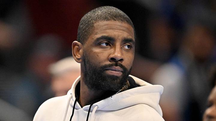 Dallas Mavericks guard Kyrie Irving looks on