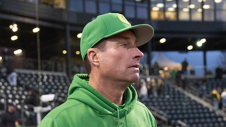 Oregon baseball coach Mark Wasikowski joins his team after defeating Toledo at PK Park in Eugene Friday, Feb. 14, 2025.