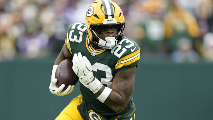 Green Bay Packers running back Emanuel Wilson (23) carries the ball against the Minnesota Vikings during the first half at Lambeau Field. Green Bay Packers running back Emanuel Wilson (23) carries the ball against the Minnesota Vikings during the first half at Lambeau Field.