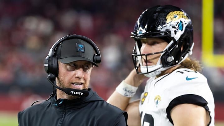 Nov 23, 2025; Glendale, Arizona, USA; Jacksonville Jaguars head coach Liam Coen with quarterback Trevor Lawrence (16) against the Arizona Cardinals at State Farm Stadium. Mandatory Credit: Mark J. Rebilas-Imagn Images