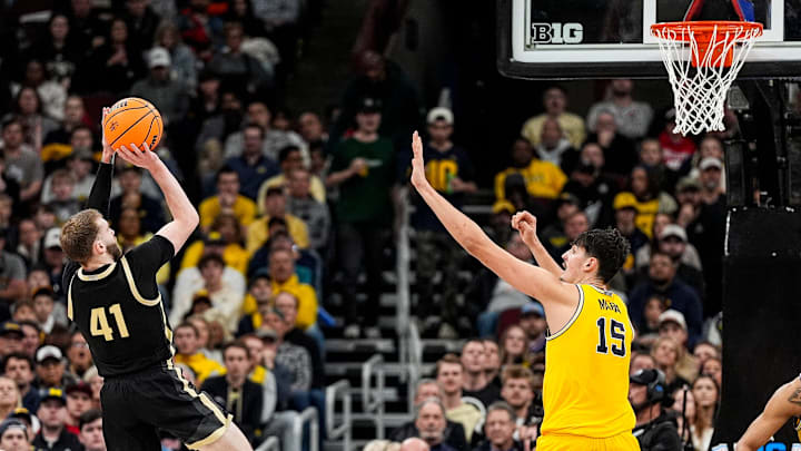 Purdue guard Braden Smith (41) makes a jump shot against Michigan center Aday Mara (15) Purdue guard Braden Smith (41) makes a jump shot against Michigan center Aday Mara (15)