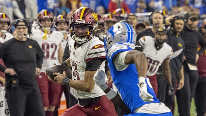 Washington Commanders quarterback Jayden Daniels (5) runs the ball against Detroit Lions. Washington Commanders quarterback Jayden Daniels (5) runs the ball against Detroit Lions.